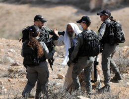 Suleiman al-Hathalin confronts Israeli soldiers during the demolition of his house under the pretext of building without a permit in Yatta south of Hebron in the West Bank, on December 6, 2021. (Photo: APA Images/Mamoun Wazwaz)