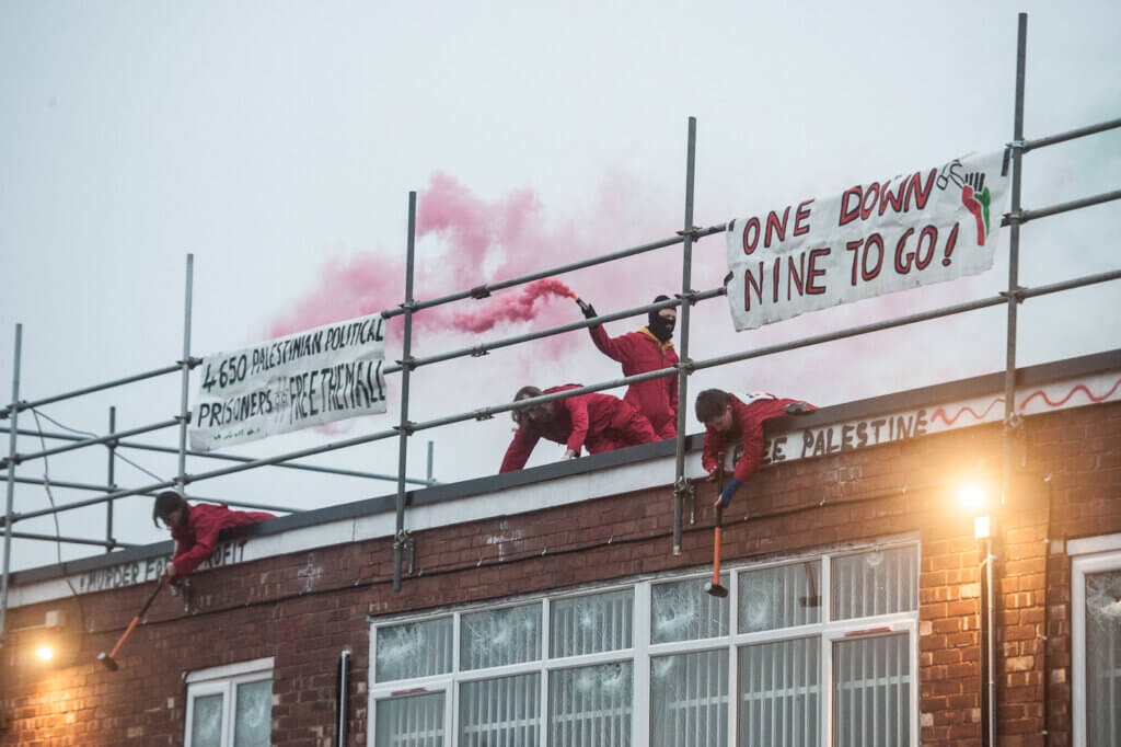 "One Done, Nine To Go" -- Activists with Palestine Action occupy Elbit System's subsidiary, UAV Engines Ltd, in Shenstone, Staffordshire on January 24, 2022. (Photo: Guy Smallman)