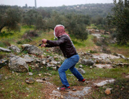 Palestinian protesters clash with Israeli security forces following a demonstration against settlements in the village of Beita in the West Bank, on March 18, 2022. (Photo: Shadi Jarar'ah/APA Images)