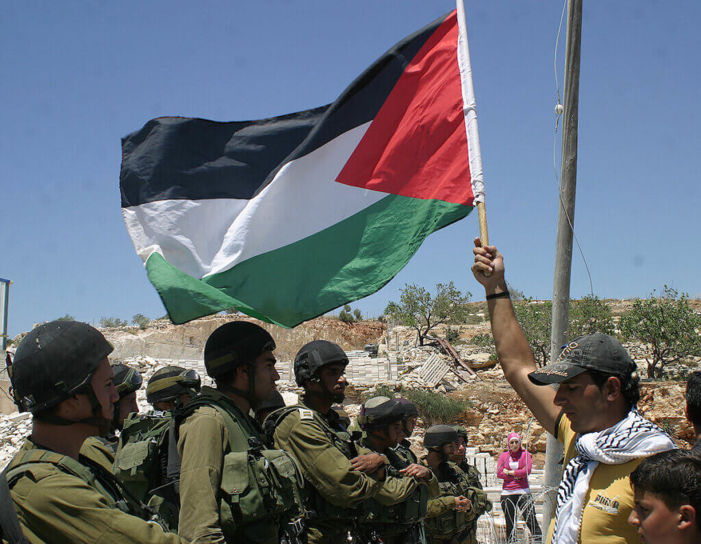 Israeli soldiers engage with Palestinian protesters during a demonstration against Israel's separation barrier in the West Bank village of Maasarah near Bethlehem, June 5, 2009. (Photo: Najeh Hashlamoun/APA Images)