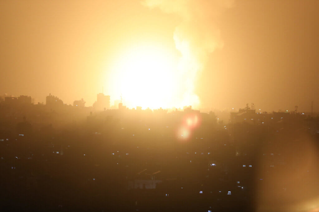 Flames rise during Israeli air strikes in the southern Gaza Strip, April 19, 2022. (Photo: Ashraf Amra/APA Images)