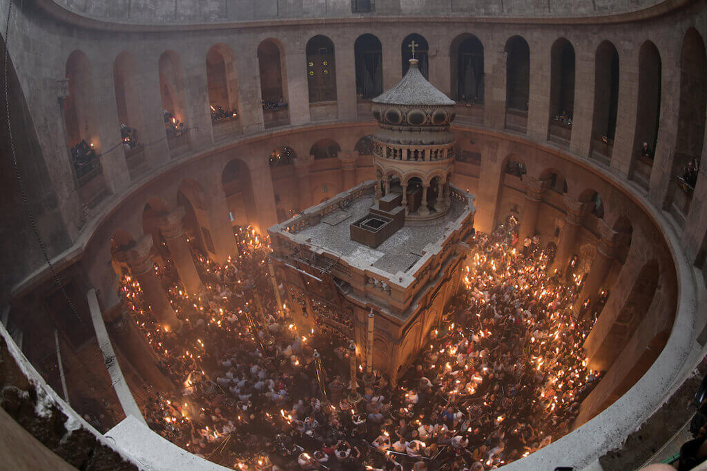 Orthodox Christian worshippers attend the Holy Fire ceremony in the Church of the Holy Sepulchre in Jerusalem's Old City, on April 27, 2019. (Photo by Afif Amera/WAFA)