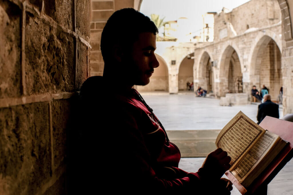 A teen reads the Quran during Ramadan in the Great Omari mosque in Gaza, which is the largest and oldest mosque in Gaza, located in Gaza’s old city. April 4, 2022