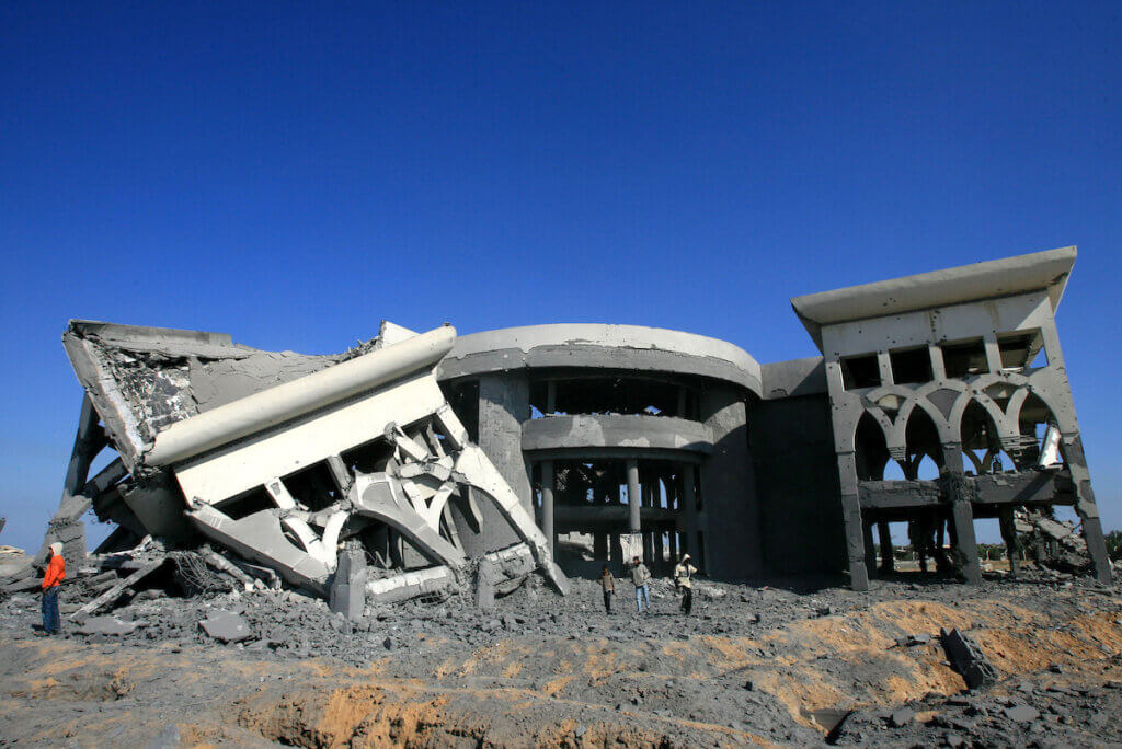 Palestinian boys leave a building at the abandoned international airport that was hit by an Israeli air strike in the southern Gaza Strip on March 20, 2010. (Photo: Abed Rahim Khatib/APA Images)