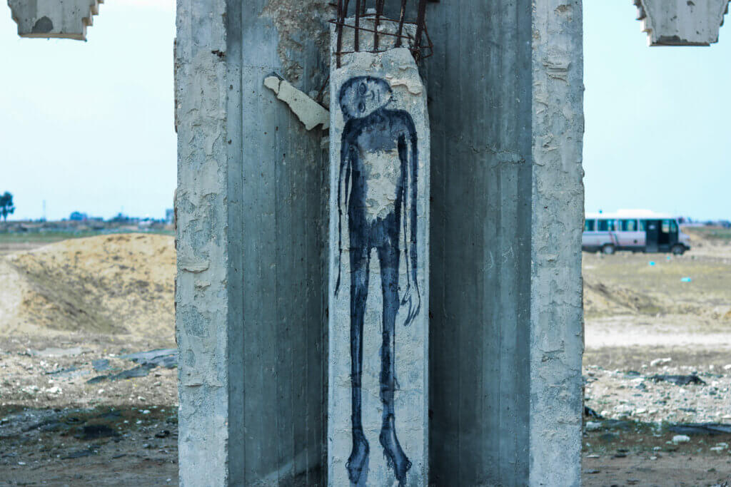 Art left on a destroyed beam of the airport (Photo: Aseel Kabariti)