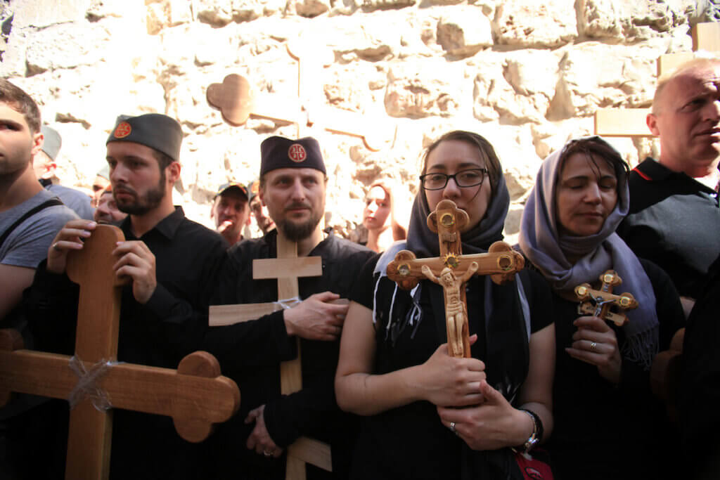 Christian Orthodox pilgrims participate in a procession marking Good Friday on April 18, 2014 in Jerusalem's old city. (Photo: Saeed Qaq/APA Images)