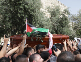 Mourners carry slain Al Jazeera veteran journalist Shireen Abu Akleh during her funeral procession in the Old City of Jerusalem on May 13, 2022. (Photo: Jeries Bssier/APA Images)