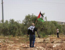 Palestinian protesters demonstrate against Israeli settlements in the village of Beita in the West Bank on May 13, 2022. (Photo: Shadi Jarar'ah/APA Images)
