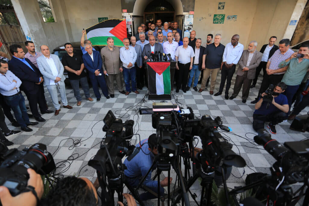 Zakaria Muammar, a member of the Hamas political bureau, speaks during a press conference following Palestinian factions meeting in Gaza City to discuss the repercussions of the Israeli flag march on May 26, 2022. (Photo: Ashraf Amra/APA Images)