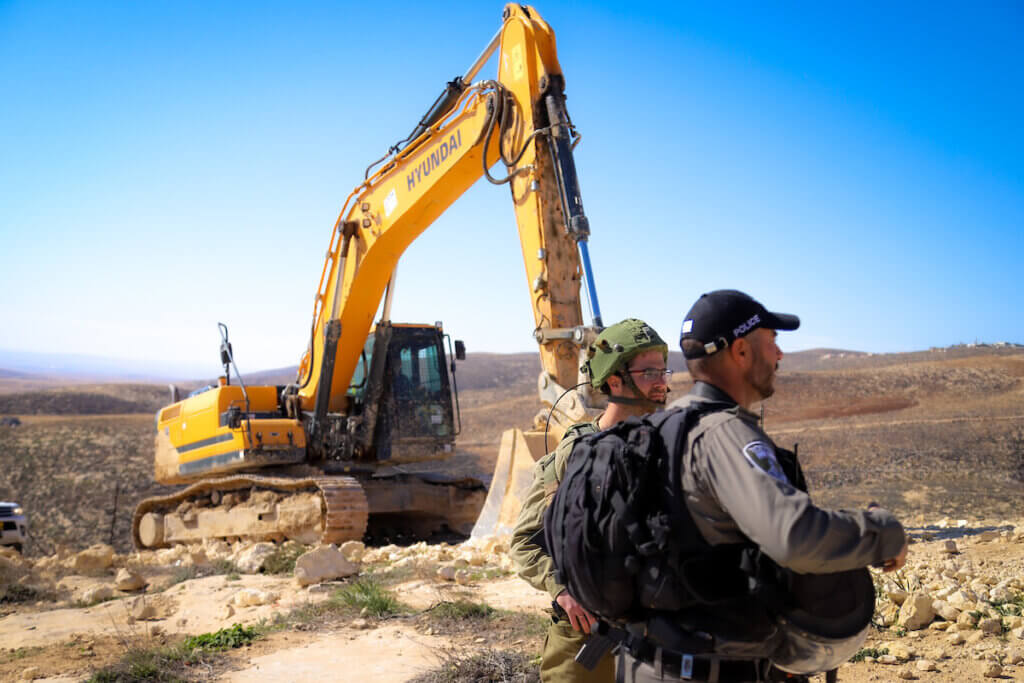 Israeli forces raze four water wells in Masafer Yatta, south of Hebron, in the southern West Bank on February 2, 2022. (Photo: Ihab Alami/APA Images)