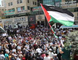 Palestinians take part in a protest against rising prices of essential goods in the West Bank city of Hebron, on June 5, 2022. (Photo: Mamoun Wazwaz/APA Images)