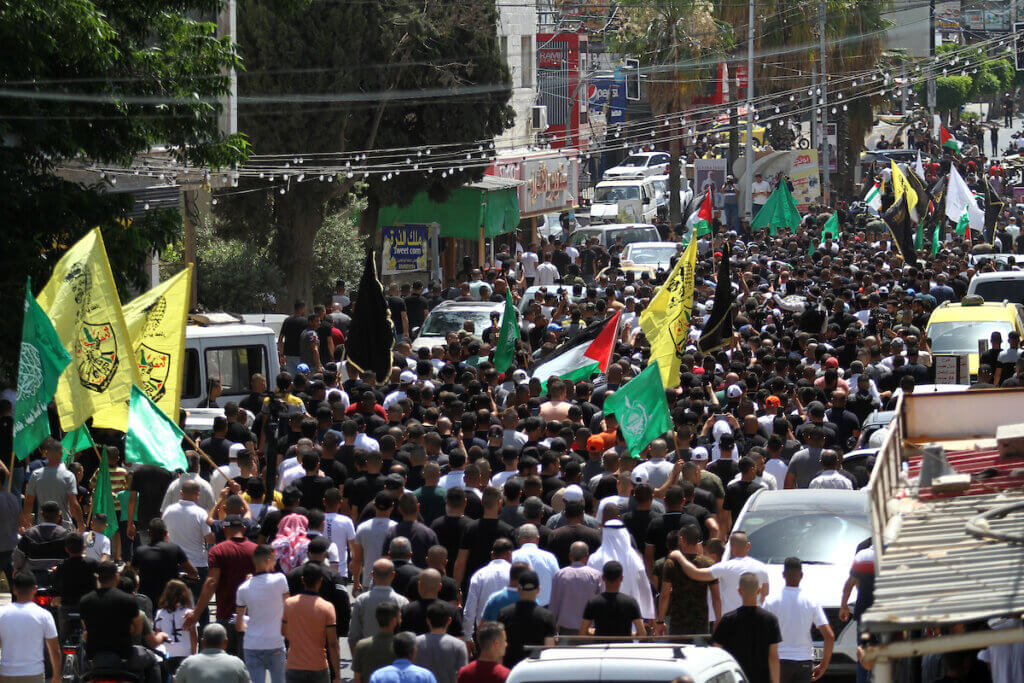 Mourners attend the funeral of three Palestinians killed during an operation by Israeli forces in Jenin, in the West Bank on June 17, 2022. (Photo: Ahmed Ibrahim/APA Images)