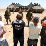 Israeli soldiers confront Palestinian activists during a protest against the Israeli military drill, in Masafer Yatta, south of Hebron, in the West Bank on June 22, 2022. (Photo: Mamoun Wazwaz/APA Images)