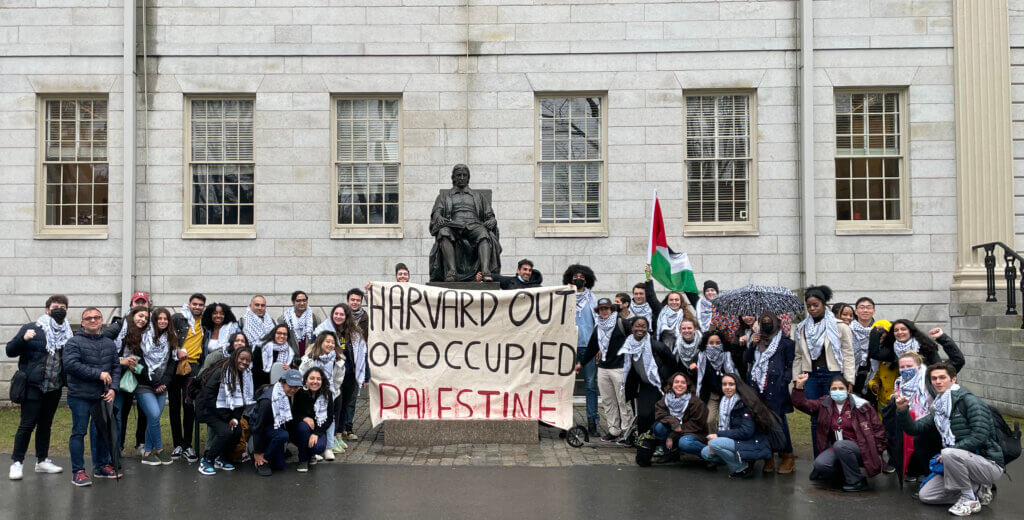 Harvard students pose for Keffiyeh Thursday, PSC's weekly visibility campaign where students wear the traditional scarf in solidarity with the Palestinian cause