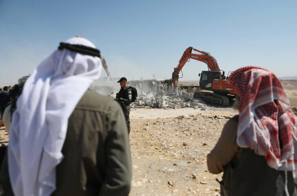 Israeli bulldozers demolish a Palestinian house in the Umm Qassa community of Masafer Yatta, on July 4, 2022. (Photo: Mamoun Wazwaz/APA Images)