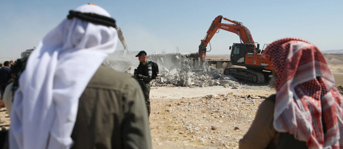 Israeli bulldozers demolish a Palestinian house in the Umm Qassa community of Masafer Yatta, on July 4, 2022. (Photo: Mamoun Wazwaz/APA Images)