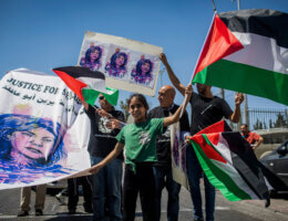 Palestinians hold up posters about Shireen Abu Akleh outside Augusta Victoria Hospital in East Jerusalem while US President Joe Biden visited the facility on July 15 2022. (Photo: Ilia Yefimovich/dpa via ZUMA Press/APAimages)