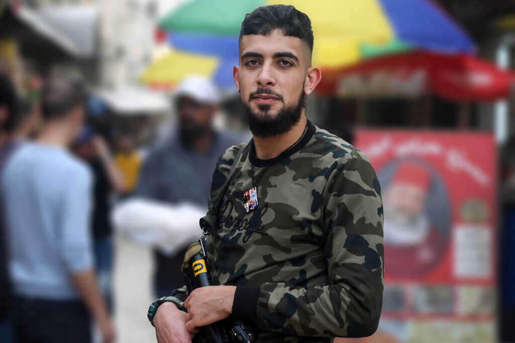 (FILE) A photo shows Ibrahim al-Nabulsi holding his weapon in the West Bank city of Nablus. (Photo by Shadi Jarar'ah/APA Images)