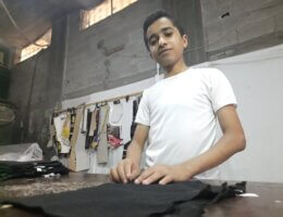 Muhannad at the sewing shop. (Photo by authors)