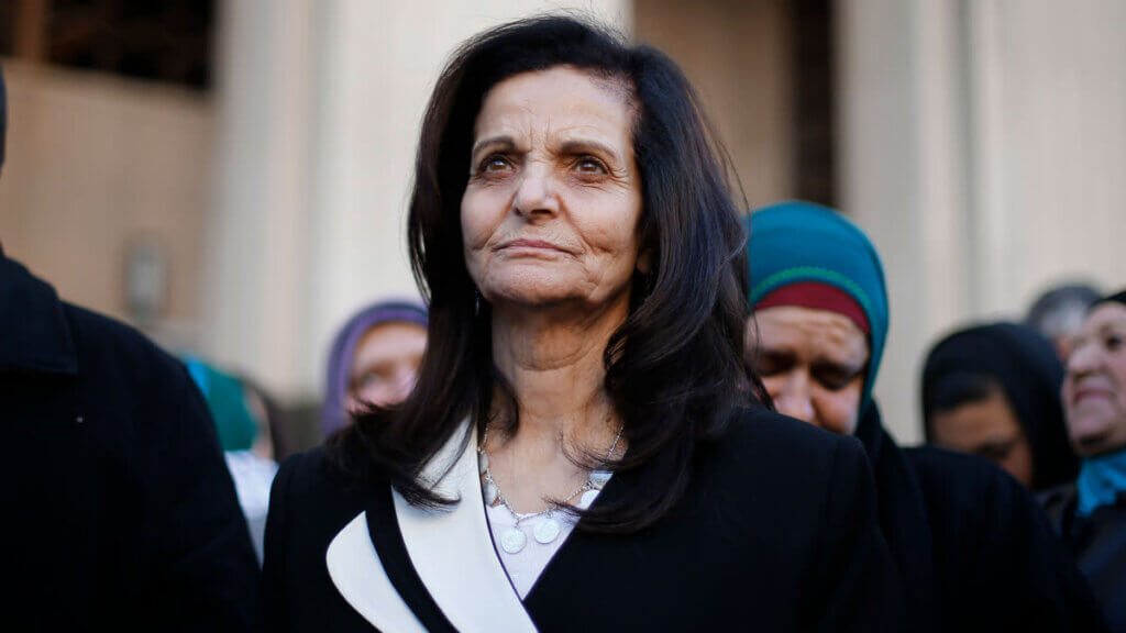 Rasmea Odeh listens to supporters after leaving federal court in Detroit, in this March 12, 2015, file photo. (AP Photo/Paul Sancya, File)