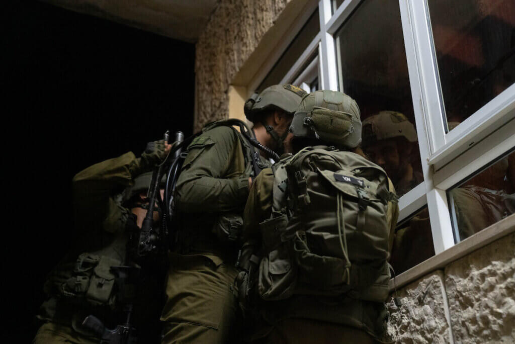 Israeli troops take position during a raid in the West Bank city of Jenin on September 28, 2022. (Photo by Israeli Prime Minister office via APA Images)