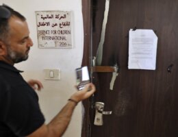 Defense for Children International - Palestine's office door outside Ramallah after Israeli forces conducted a raid and declared the organization closed on August 18, 2022. (Photo credit: AFP / Abbas Momani)