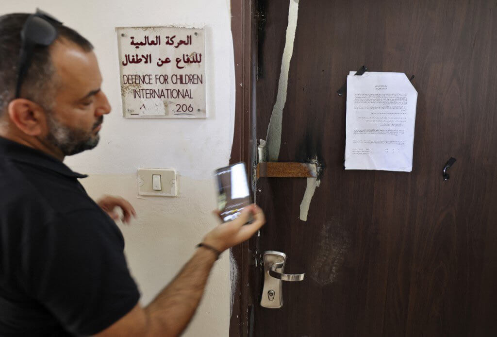 Defense for Children International - Palestine's office door outside Ramallah after Israeli forces conducted a raid and declared the organization closed on August 18, 2022. (Photo credit: AFP / Abbas Momani)