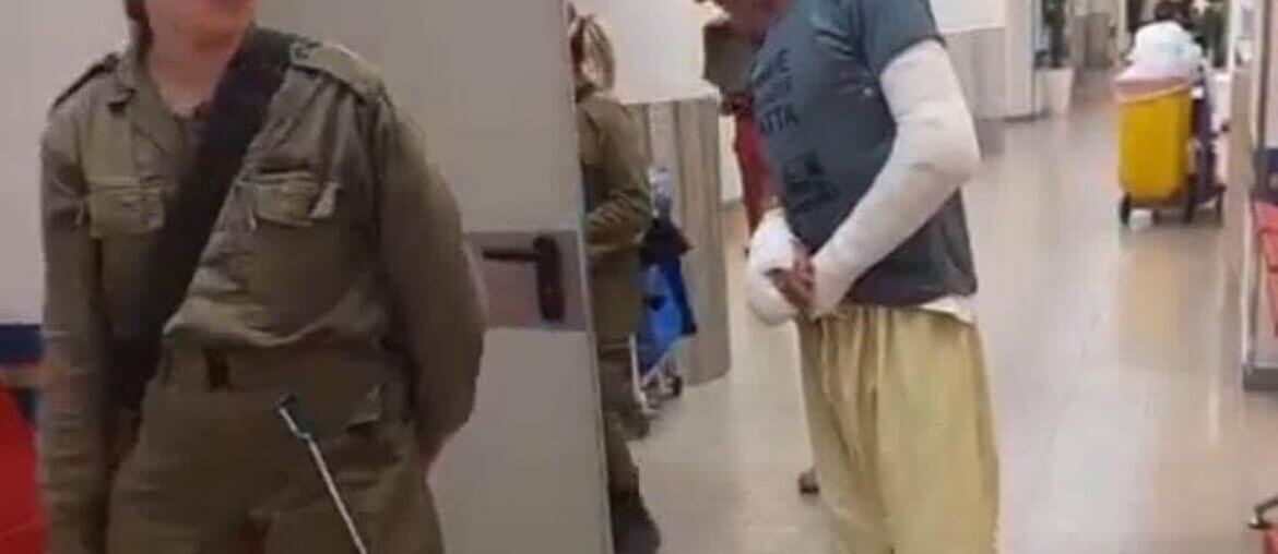Screengrab of a video showing Hafez Huraini under Israeli detention inside Soroka hospital with two broken arms following a settler attack. (Photo: Muhammad Huraini)