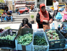 Palestinians attend a farmers' market in the Ramallah, June 25, 2022.