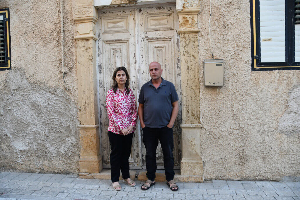 Fatima and Saleem Balbisi stand in front of their Jaffa home which has an eviction order.