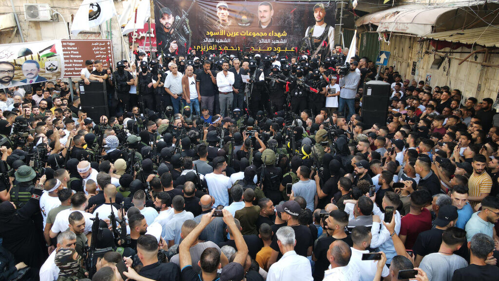 | Lions | MR Online' Den leaders address a memorial service for Mohammed al-Azizi and Aboud Suboh in the West Bank city of Nablus on September 2, 2022. (Photo: Shadi Jarar'ah/APA Images)