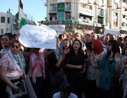 Palestinian protestors hold banners and national flags during a protest against a scheduled meeting between Palestinian President Mahmoud Abbas and the then Israeli Vice Prime Minister Shaul Mofaz in the West Bank city of Ramallah, on July 1, 2012, i nthe second day of protest against the visit. (Photo: Issam Rimawi/APA Images)
