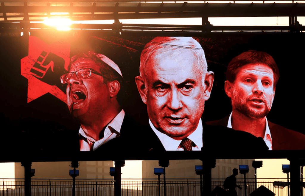A campaign poster in Tel Aviv shows, from left, Itamar Ben-Gvir, Benjamin Netanyahu and Bezalel Smotrich. (Photo: Jamal Awad/Flash90)