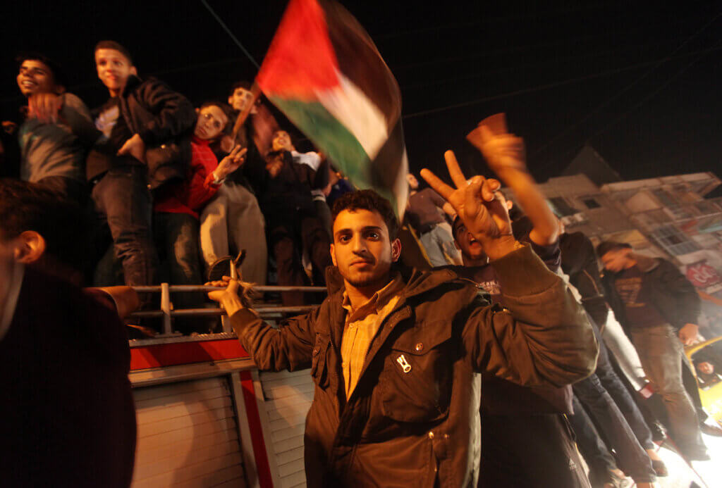 Palestinians celebrate the end of the eight-day escalation with Israeli forces in Gaza City, November 21, 2012. (Photo: Majdi Fathi/APA Images)