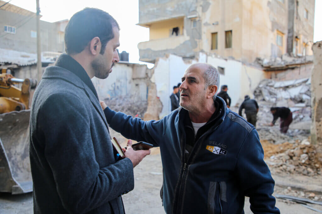 Mondoweiss Gaza Correspondent Tareq Hajjaj speaks with Nasser Abu Saif in Al-Shati Refugee Camp, Gaza, January 2023. (Photo: Mohammed Salem)