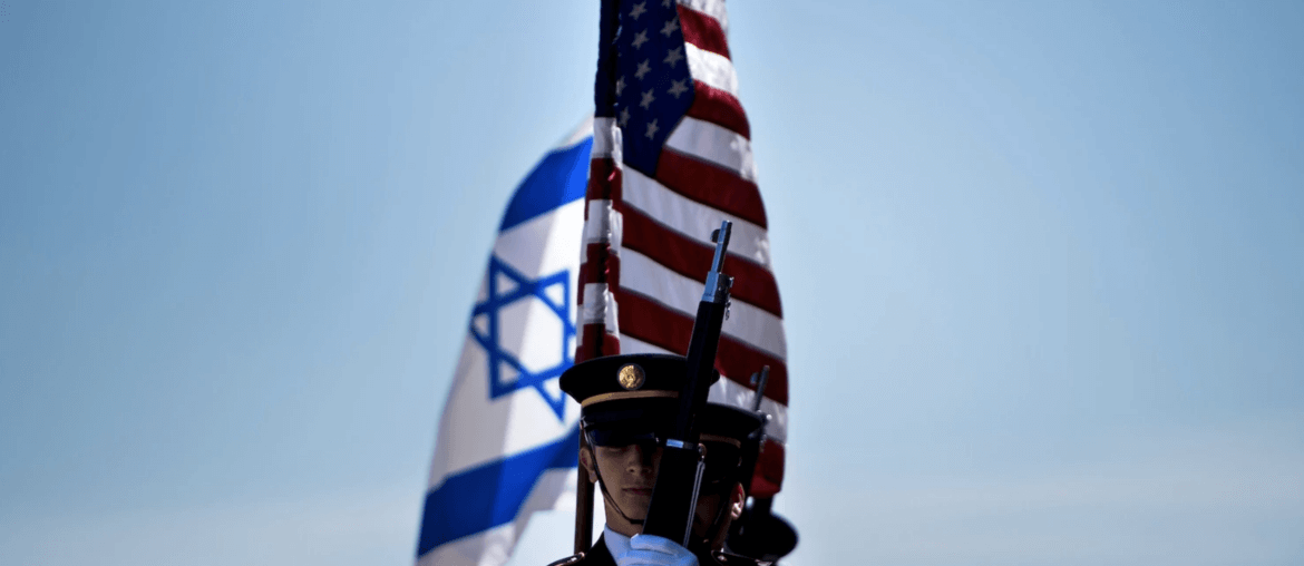 Members of the U.S. military carry the flags of Israel and the United States before the arrival of then Israeli Minister of Defense Avigdor Lieberman in Washington on April 26, 2018. (Photo: Brendan Smialowski/Getty Images)