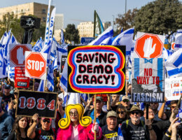Israeli protesters hold flags and signs during a protest against the Judicial reforms, outside the Knesset in Jerusalem, February 20, 2023. (Photo: Ilia Yefimovich/dpa via ZUMA Press/APA images)