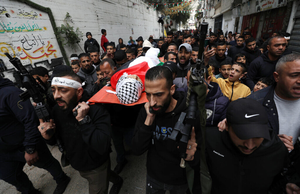 Mourners at the funeral of Muntaser al-Shawwa in Balata Refugee Camp, Nablus. Shawwa was shot by Israeli forces on February 8 and succumbed to his wounds on February 20, 2023. (Photo: Stringer/APA Images)