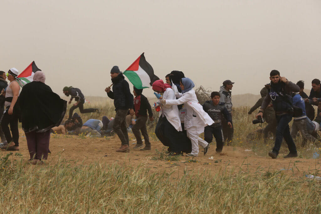 The first day of the Great March of Return, March 30, 2019, at the Israel-Gaza border fence near Khan Younis. (Photo: Ashraf Amra/APA Images)
