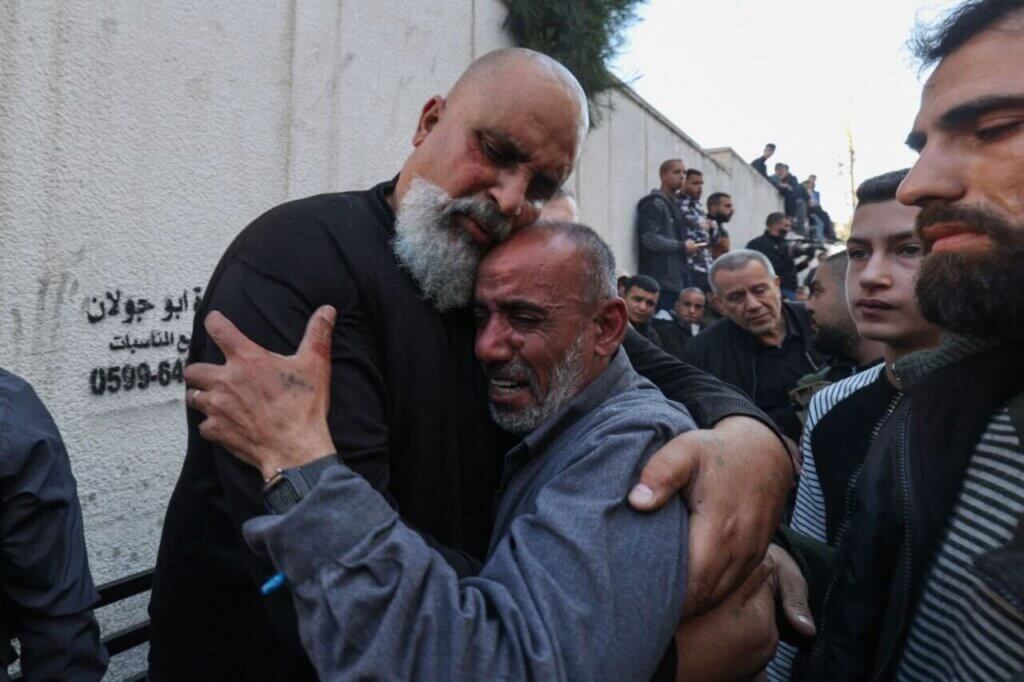 Amin Khazem (left), fathers of Nidal Khazem, and the father of Yousef Shreim (right) at their sons' funerals (Photo: Social Media)