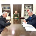 Yair Lapid meets with Benjamin Netanyahu at Israeli military HQ in Tel Aviv on April 9, 2023. (Photo: Israeli Government Press Office)
