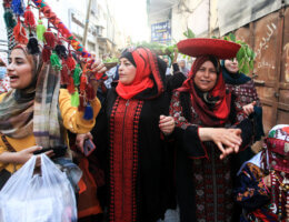 Palestinian women dressed in traditional embroidered Palestinian dresses participate in a wedding simulating traditional Palestinian weddings on the National Day of Palestinian Heritage, in Gaza city on October 7, 2021.