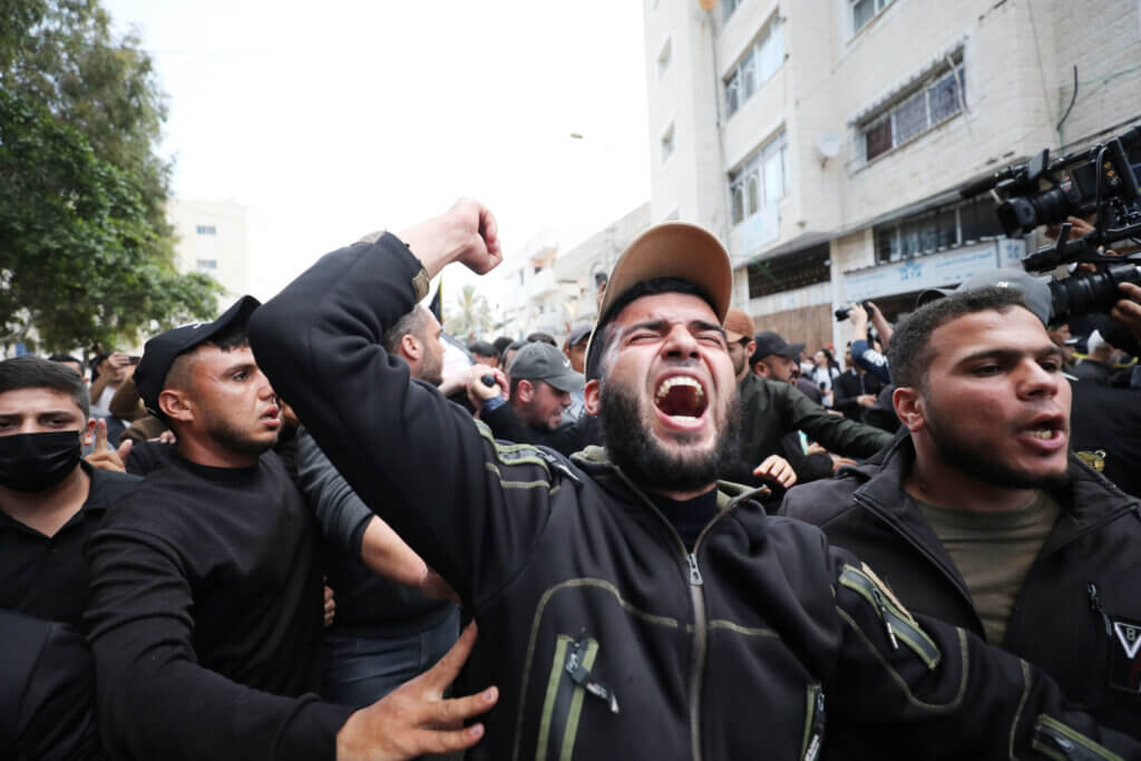 Palestinian mourners at the funeral procession of those who were killed in Gaza during Israeli airstrikes. May 9, 2023 (APA Images)