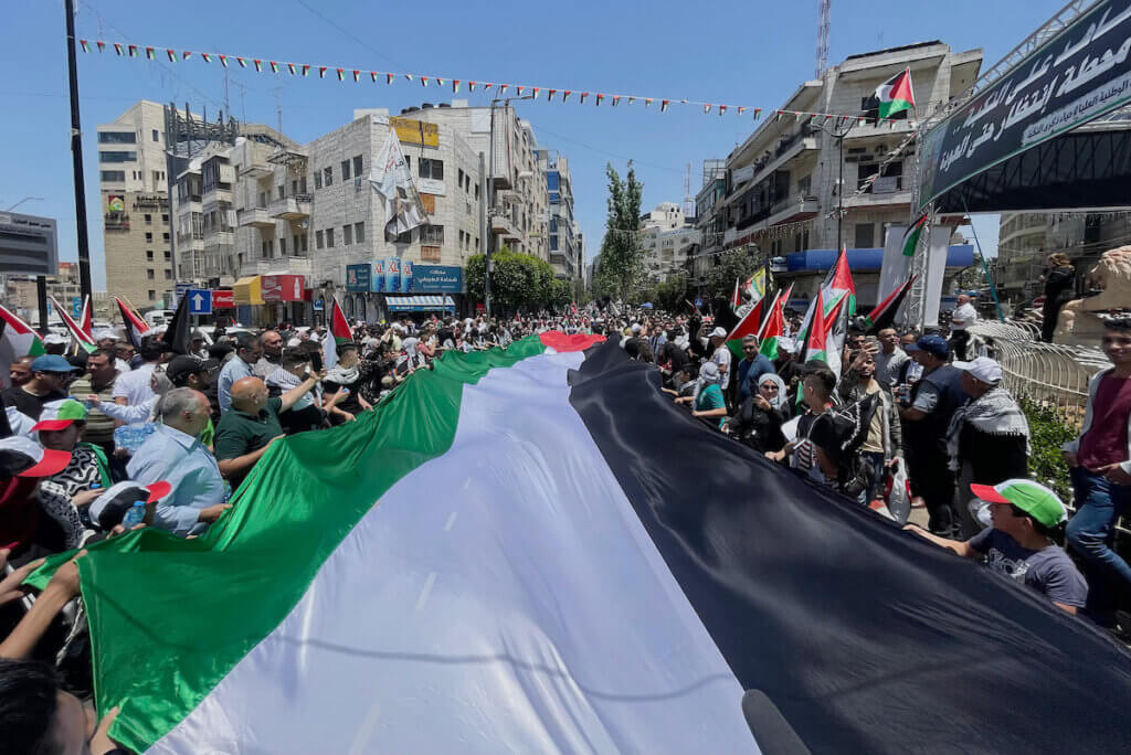 Palestinians take part in a march to mark the 75th anniversary of Nakba, or the "catastrophe" in the West Bank city of Ramallah on May 15, 2023. (Photo: Ahmad Arouri/APA Images)