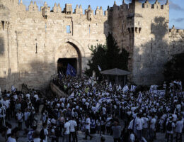 Crowds of Israeli settlers carrying the Israeli flag outside Damascus Gate in Jerusalem as they take part in the Flag March, an annual event during which Israeli right-wing nationalists celebrate the Israeli conquest of East Jerusalem in 1967.
