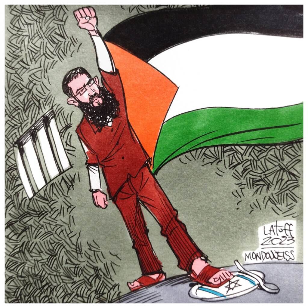 An illustration of Khader Adnan dressed in prison clothes with fist upraised in victory and the Palestinian flag extending from his side as he steps on an Israeli plate and fork, signifying his hunger strike and refusal to surrender. (Cartoon: Carlos Latuff)