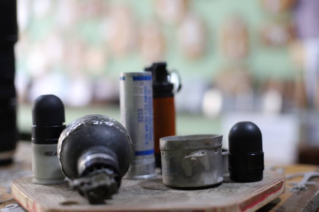 Tear gas canisters, sound grenades, and other weapons that have ben fired by Israeli forces into the Aida refugee camp. (Malik Hamamra/Mondoweiss) Aida Refugee Camp, occupied West Bank, May 2023.