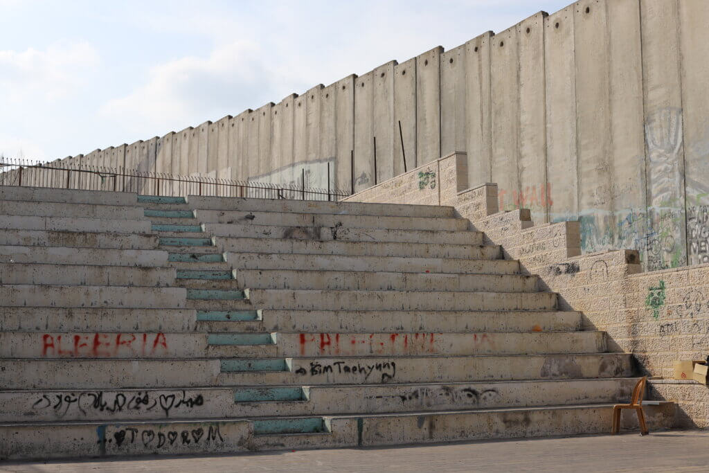 The Israeli Apartheid wall runs along the length of the Aida refugee camp. (Malik Hamamra/Mondoweiss) Aida refugee camp, occupied West Bank, May, 2023. 