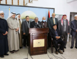 Chairman of the Political Committee at the Palestinian Legislative Council, Mahmoud al-Zahar, speaks during a press conference in Gaza City, on March 1, 2023, while flanked by other members of the Council as he stands at a podium.