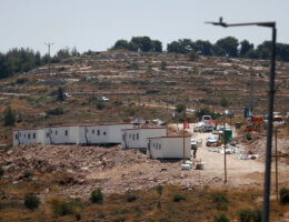 A distant picture of trailers erected on a hill for a new outpost near the Israeli settlement of Ma'ale Levona in the West Bank, June 27, 2023.